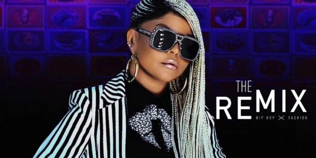 Cortés Filmworks: A woman with long, beaded braids and large sunglasses is wearing a black and white striped outfit adorned with rhinestones. She stands confidently against a colorful, patterned background, embodying "The Remix: Hip Hop x Fashion." This striking image could be an iconic scene from a Cortés Filmworks production that seamlessly blends urban culture with high fashion. : CortesFilmworks.com